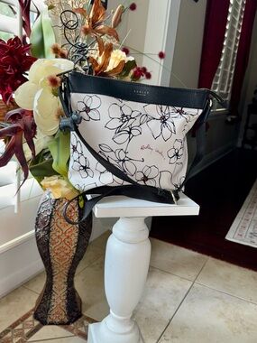 RADLEY LONDON Black & White Floral Crossbody with Subtle Red Accents